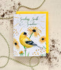 Greeting card with a yellow bird (goldfinch) and sunflowers on a textured beige background